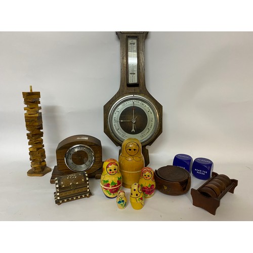 242 - Assortment of wooden items including Russian dolls, barometer, clock etc