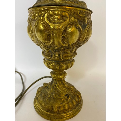 244 - Ornate table lamp in gold tone metal measuring 45 cms tall