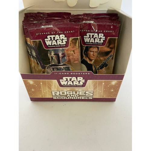 310 - Star Wars Rogues and Scoundrels TCG box of 13 sealed packets containing 7 common cards, 3 uncommon c... 