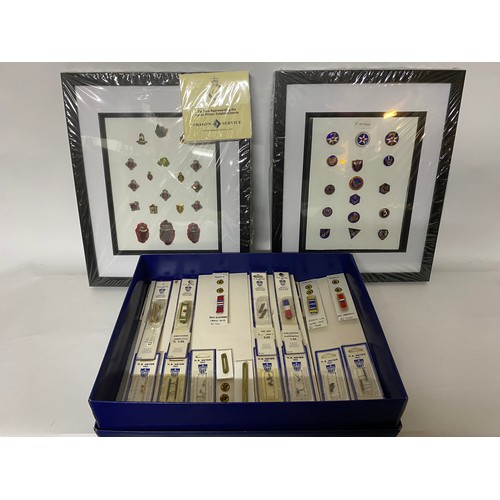 343 - Selection of ribbons, stars, oak leaves USA in box and 2 x framed sets of enamel badges, one contain... 