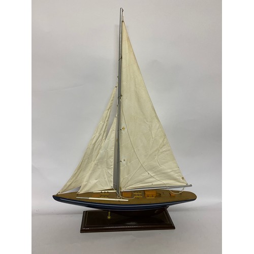 367 - Wooden model Yacht on stand with canvas sails, 84 x 61cms