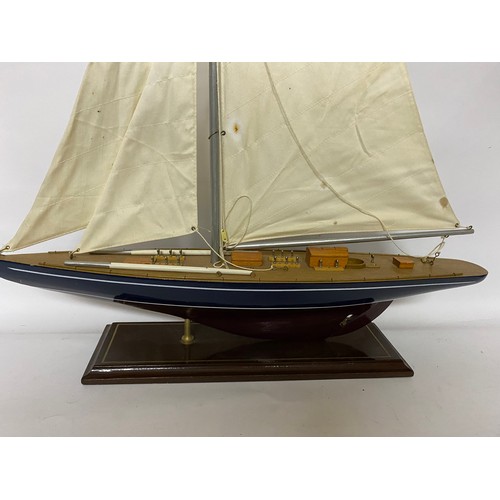 367 - Wooden model Yacht on stand with canvas sails, 84 x 61cms