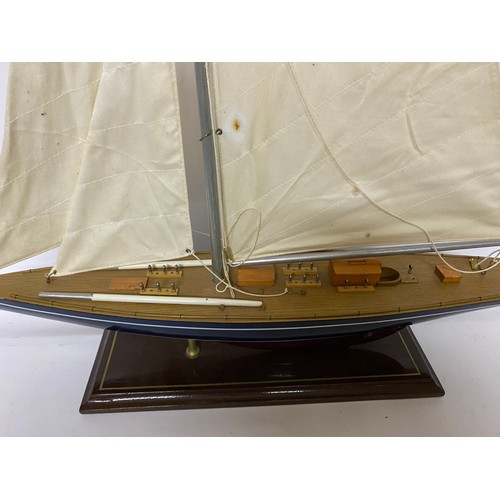 367 - Wooden model Yacht on stand with canvas sails, 84 x 61cms