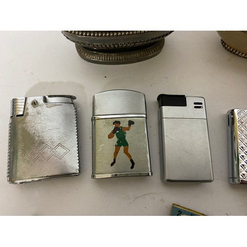 21 - Collection of vintage lighters and cigarette cases.