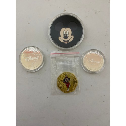 42 - 4 Commemorative Disney coins, Mickey Mouse, Lumiere and Dory