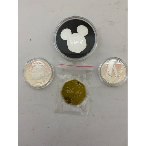 42 - 4 Commemorative Disney coins, Mickey Mouse, Lumiere and Dory