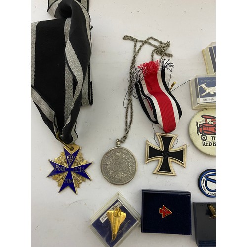 61 - Collection of Military badges, pins and medals.