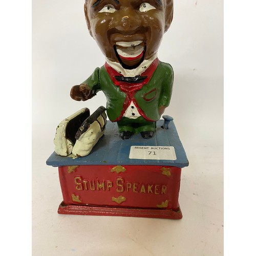 71 - Black boy stump speaker cast iron money box.