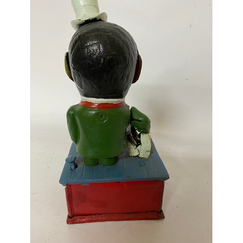 71 - Black boy stump speaker cast iron money box.