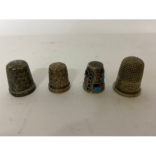 74 - 4 sterling silver thimbles.