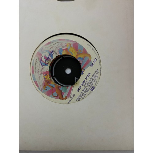 404 - Selection of 67 singles in singles case. Artists include Queen, Elton John, Rod Stewart, Joe Jackson... 