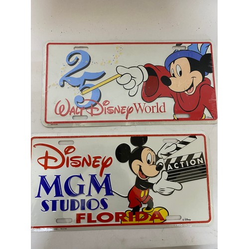 415 - Selection of 4 vintage American license plates, MGM, USA-1, Epcot and 25 years of Walt Disney World