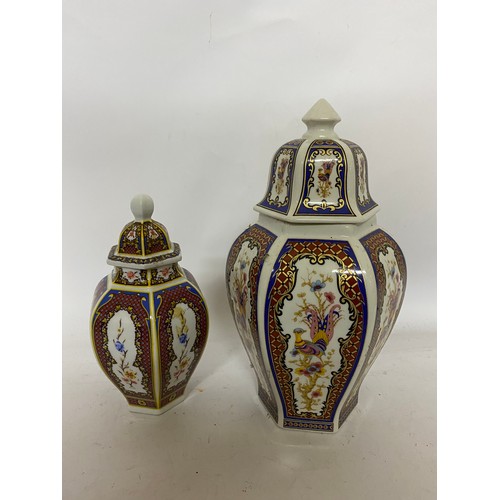 420 - 2 x pairs of Chinese vases and a pair of Chinese urn's. Largest vase measures 32 cms