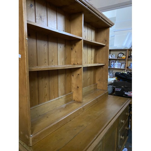 370 - Large pine dresser with drawers and cupboards to base and shelves to top,  base measures 60 x 76 x 1... 