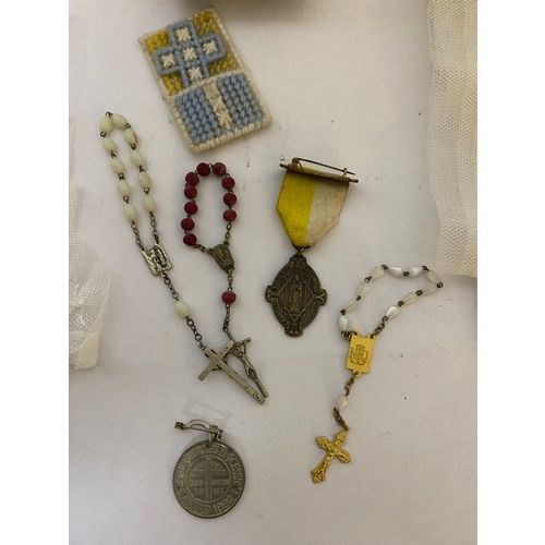 116 - Vintage religious items including communion veils, rosay beads, medallions and bibles.