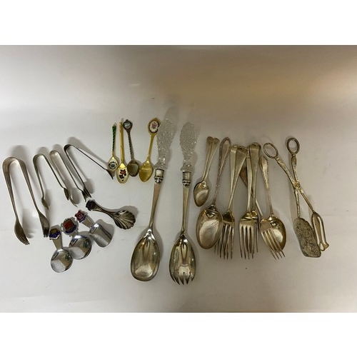 143 - Selection of cutlery including serving spoons, caddy spoons and sugar nips.