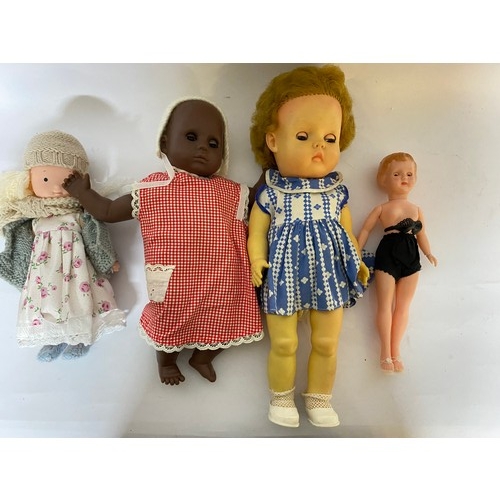 163 - Assortment of vintage dolls of various sizes.