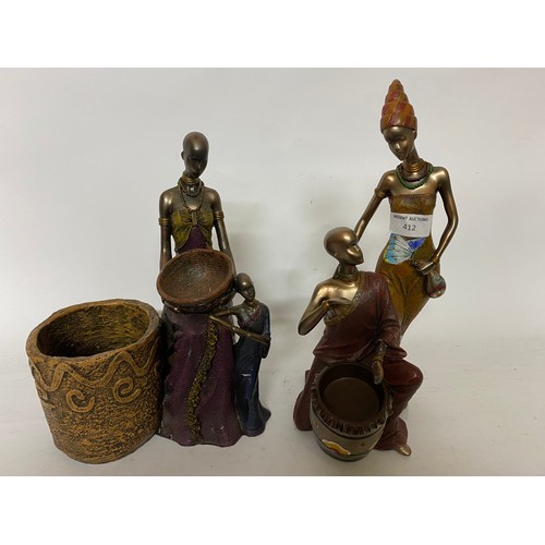 412 - 2 x African Tribal family ornaments measuring 28 cms tall