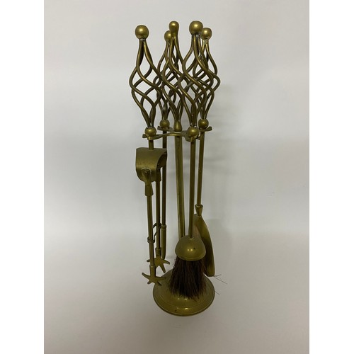 657 - Brass companion set comprising tongs, poker, brush and shovel