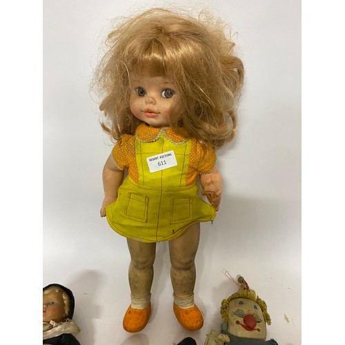 611 - Selection of vintage dolls and toys.