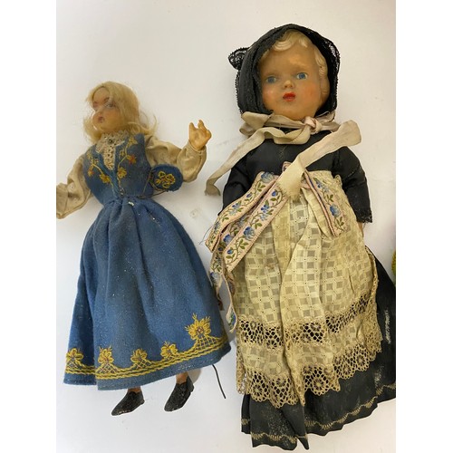 611 - Selection of vintage dolls and toys.