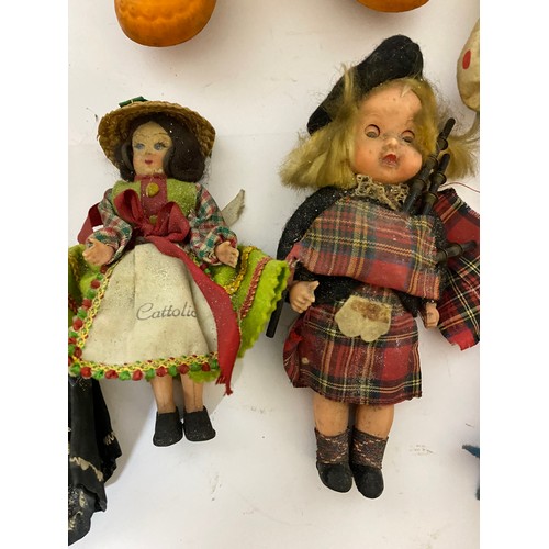 611 - Selection of vintage dolls and toys.