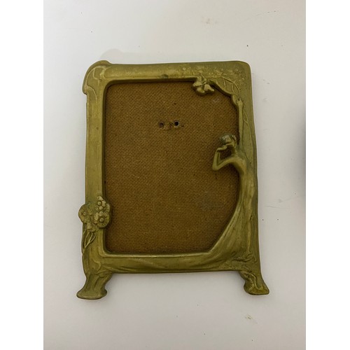 658 - An art deco and art Nouveau brass photo frame both measuring 16 cms tall