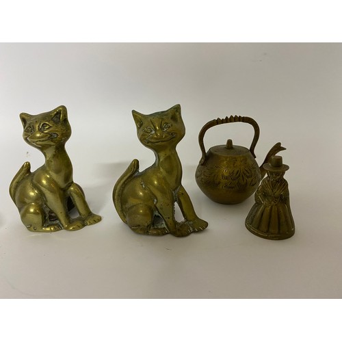 659 - Selection of brassware including 2 x cat candle holders, a duck head for a walking stick, a Welsh la... 