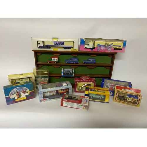 665 - 15 x die cast collectable models mainly boxed and a display shelf measuring 54 x 27 cms