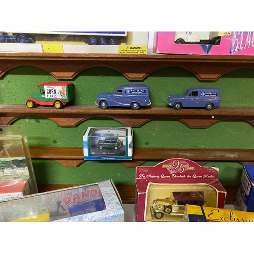 665 - 15 x die cast collectable models mainly boxed and a display shelf measuring 54 x 27 cms