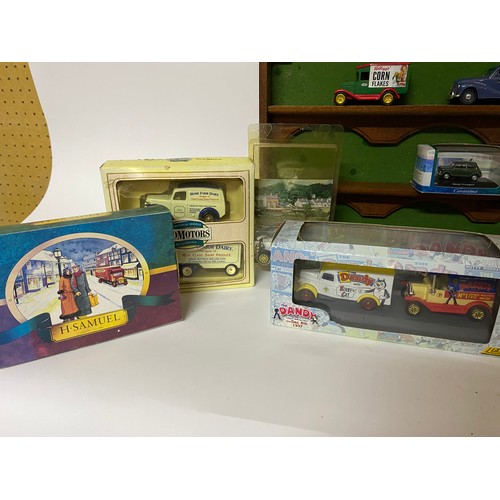 665 - 15 x die cast collectable models mainly boxed and a display shelf measuring 54 x 27 cms