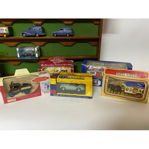 665 - 15 x die cast collectable models mainly boxed and a display shelf measuring 54 x 27 cms