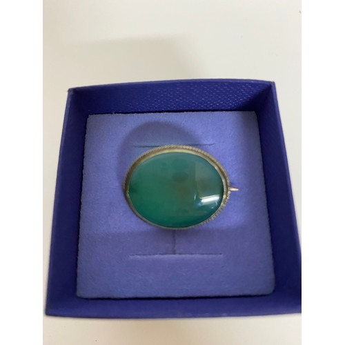 515 - Sterling silver brooch set with large green stone