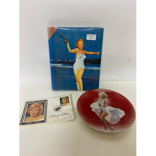586 - Marilyn Monroe postcard album, plate and collection of first day covers.