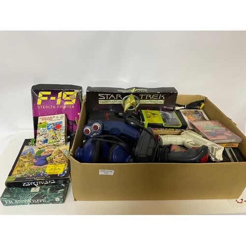 732 - Box of retro gaming items. Games, leads, peripherals etc and a 1994 interactor virtual reality kit