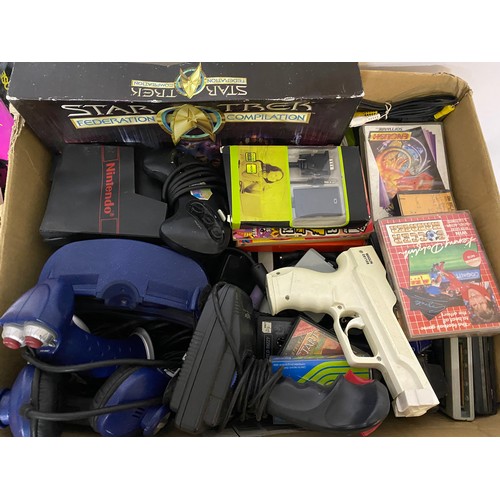 732 - Box of retro gaming items. Games, leads, peripherals etc and a 1994 interactor virtual reality kit