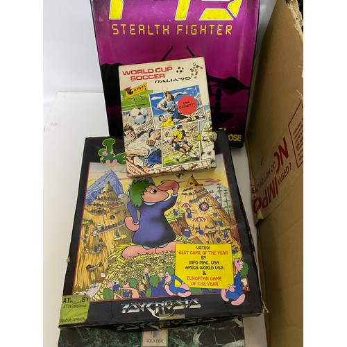 732 - Box of retro gaming items. Games, leads, peripherals etc and a 1994 interactor virtual reality kit