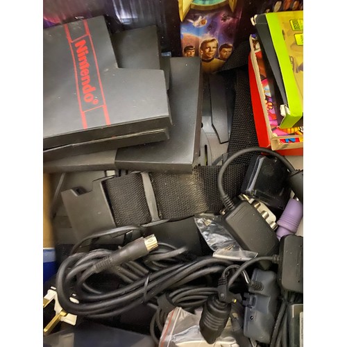 732 - Box of retro gaming items. Games, leads, peripherals etc and a 1994 interactor virtual reality kit