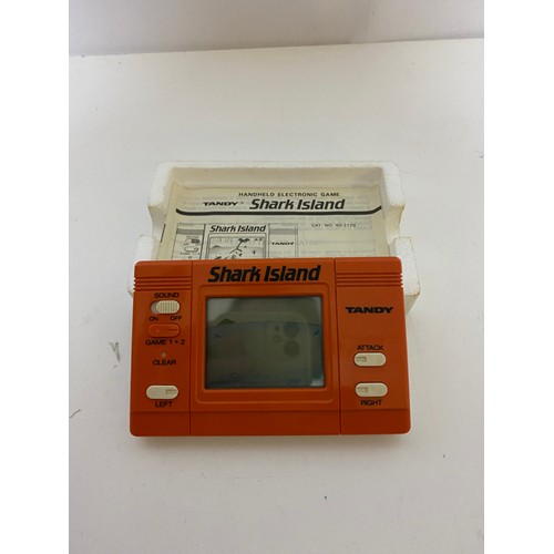 776 - Vintage Tandy Shark Island boxed mint condition handheld electronic game with instruction booklet. C... 