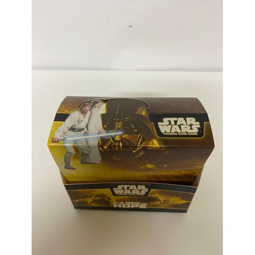 780 - Star Wars A New Hope TCG box of 15 sealed packets containing 7 common cards, 3 uncommon cards and 1 ... 