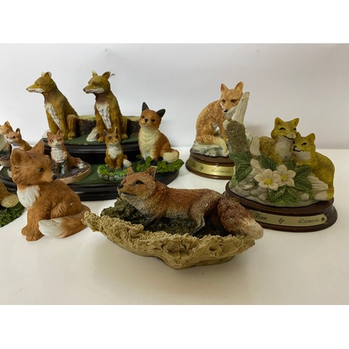 574 - Collection of foxes and stand