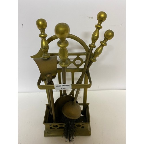 834 - Brass companion set containing tongs, poker, brush and shovel