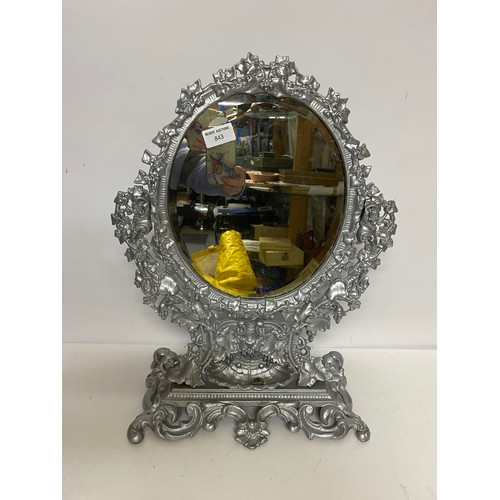 843 - Ornate metal bevelled dressing table mirror in silver measuring 49 cms tall