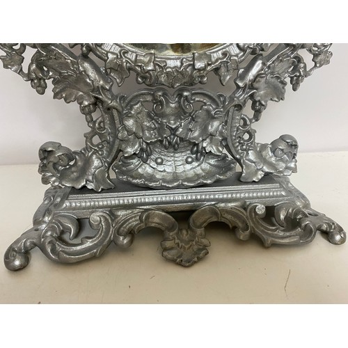 843 - Ornate metal bevelled dressing table mirror in silver measuring 49 cms tall