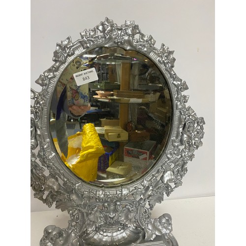 843 - Ornate metal bevelled dressing table mirror in silver measuring 49 cms tall