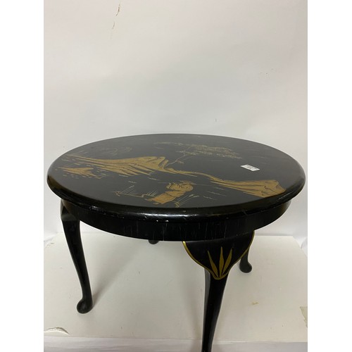 838 - Gold and silver Oriental style table measuring 60 cms diameter