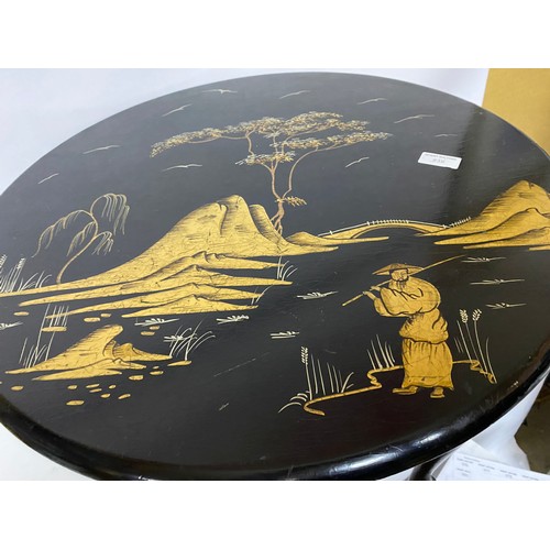 838 - Gold and silver Oriental style table measuring 60 cms diameter