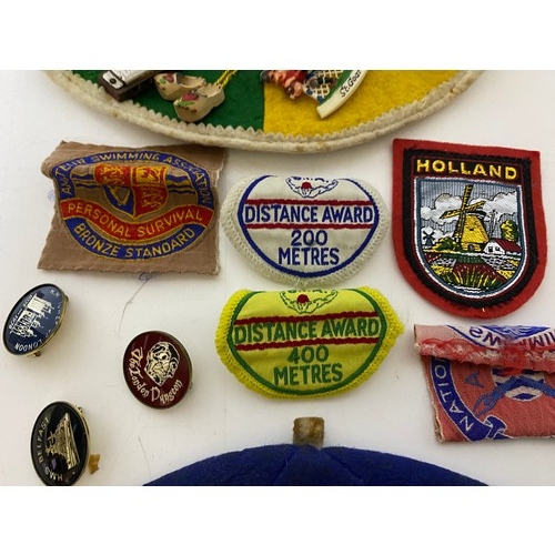 573 - 2 x vintage caps and badges