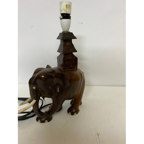 829 - Wooden elephant table lamp measuring 36 cms tall