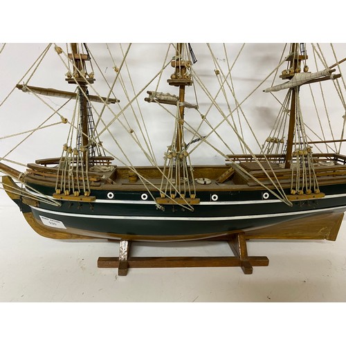 930 - A model of a three masted sailing ship measuring 64 cms long